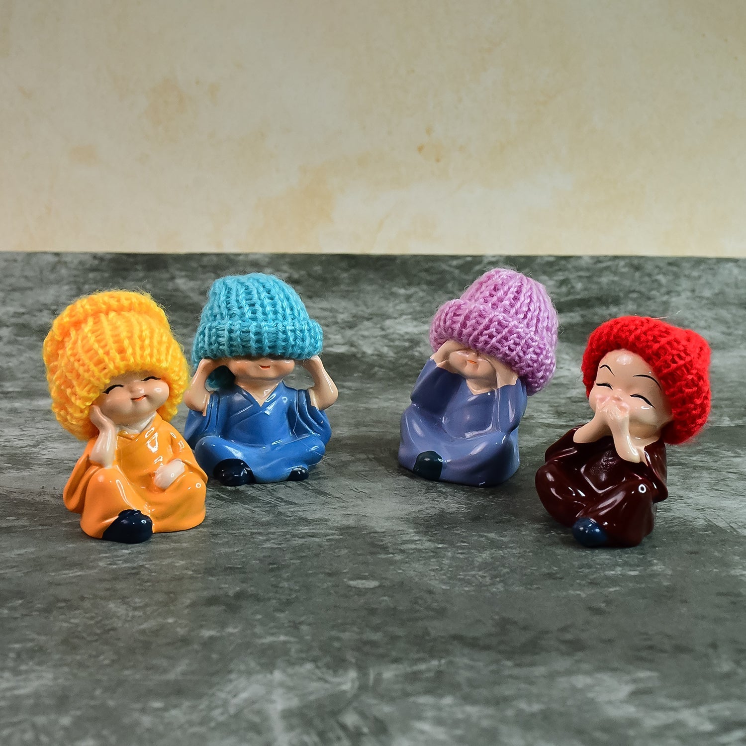 Decorative Resin Monk Buddha Showpiece Set of 4 with Traditional Straw Hats Decorative Resin Monk Buddha Showpiece Set of 4 with Traditional Straw Hats